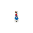 Small figurine of a cat character in a blue dress with a red ribbon on a white background