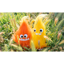 2 plush fire sprites, one orange and one yellow, both with large plastic eyes and oversized teeth.