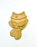 Matte finish ceramic sculpture of a taiyaki - a fish shaped brown pastry with an opening at the top to act as a vase.