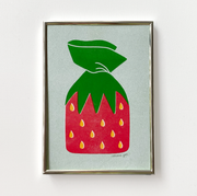 3 color risograph print in green, red and yellow of a piece of strawberry hard candy in its iconic strawberry wrapper. Background is light green and piece is in a thin metal frame.