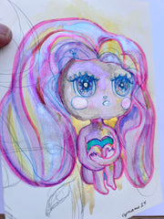 Illustration of a character with a very large head and flowing pink, purple and yellow hair. It has glittery eyes and sits with its knees pulled into its chest.