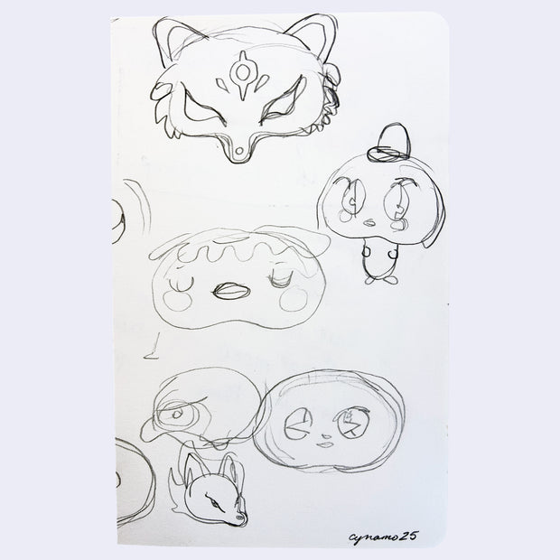 Graphite sketches on white paper of yokai - kitsune, kappa and others.