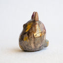 Ceramic figurine in the shape of Totoro, with a raku fired glaze that makes it iridescent over a gold base.
