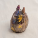 Ceramic figurine in the shape of Totoro, with a raku fired glaze that makes it iridescent over a gold base.