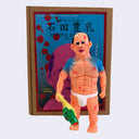 Soft vinyl figure of a nude, muscular Japanese man with many scars on his body and holding a green decapitated head.
