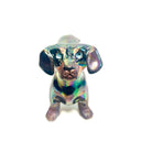 An iridescent dachshund-shaped sculpture with a metallic, rainbow-like finish on a plain white background.