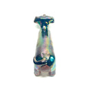 An iridescent dachshund-shaped sculpture with a metallic, rainbow-like finish on a plain white background.