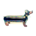 An iridescent dachshund-shaped sculpture with a metallic, rainbow-like finish on a plain white background.