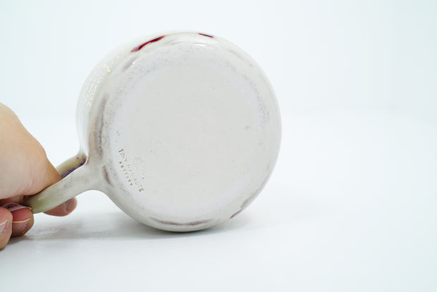 Underside of ceramic mug, unglazed.