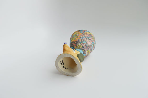 Ceramic floral cup with a brown floppy eared dog as a handle.