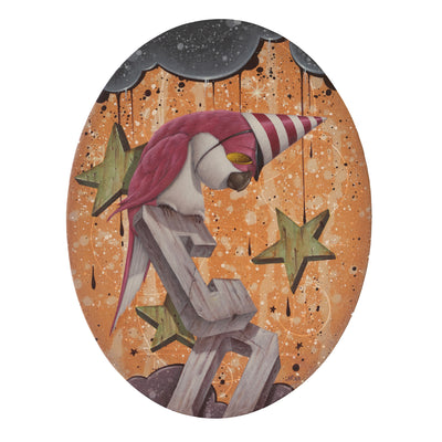 Painting on oval shaped panel of a pink bird wearing a red striped party hat and sitting atop of wooden cut out letters "C O". Background is orange with wooden stars and dark clouds.