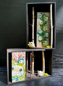 2 shadowboxes pieces places together.