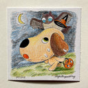 Cartoon dog with a very large head, it has an owl atop its head knocking its witch hat off.