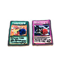 Two hand-painted clay cards on a white background. The left card is teal with the text 'Graceful Dice' and a yellow and blue skull illustration.