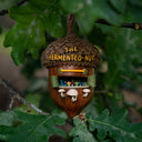 Decorative acorn-shaped sculpture, fashioned into a miniature bar with 'The Fermented Nut' text on its roof and mushroom stools in front of several beer taps.