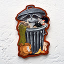 Mixed media artwork of a raccoon in a trashcan, with trash scattered all around.