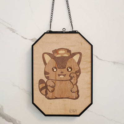 Flat wooden panel sculpture of a cute cat, standing on its hind legs with a curved upper paw. Its pattern is the same as the Catbus from My Neighbor Totoro.