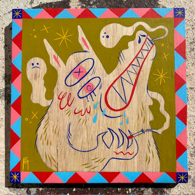 Painting on exposed wooden panel of a wolf creature, with pink eyes and a fanged smile. It smokes a cigarette and emits smoke clouds that look like ghosts. Background is olive green and bordered with a red, blue and pink triangle pattern.