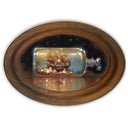 Painting of a sailboat inside of a bottle.