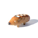 Ceramic sculpture of a brown dog made to look like a pencil, with a pointed tip black nose and a pink eraser shaped butt. It has several holes atop its back to hold pens.