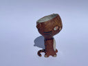 Small ceramic animal figure of a cat or brown tiger or sorts, with a cup as its head.