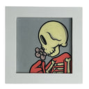 Framed artwork of a skeleton holding a flower on a gray background