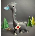 Vinyl plush sculpture of a mostly flat dimension long neck dinosaur, gray in color and with blue flames coming out of its mouth. It has a first aid kit tied around its body.