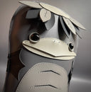 Grayscale vinyl plush doll with a flat body shape of a Kappa, with a large bird-like beak and a turtle like face, with a flat top head and leaves around it.