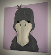 Vinyl fabric sculpture of a cartoon style shoebill bird, looking straight on so its beak looks flat on a lilac colored square canvas.