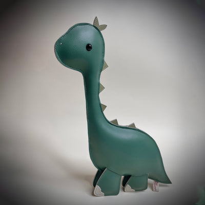 Plush, mostly flat, sculpture of a long necked green dinosaur with cute beaded eyes.
