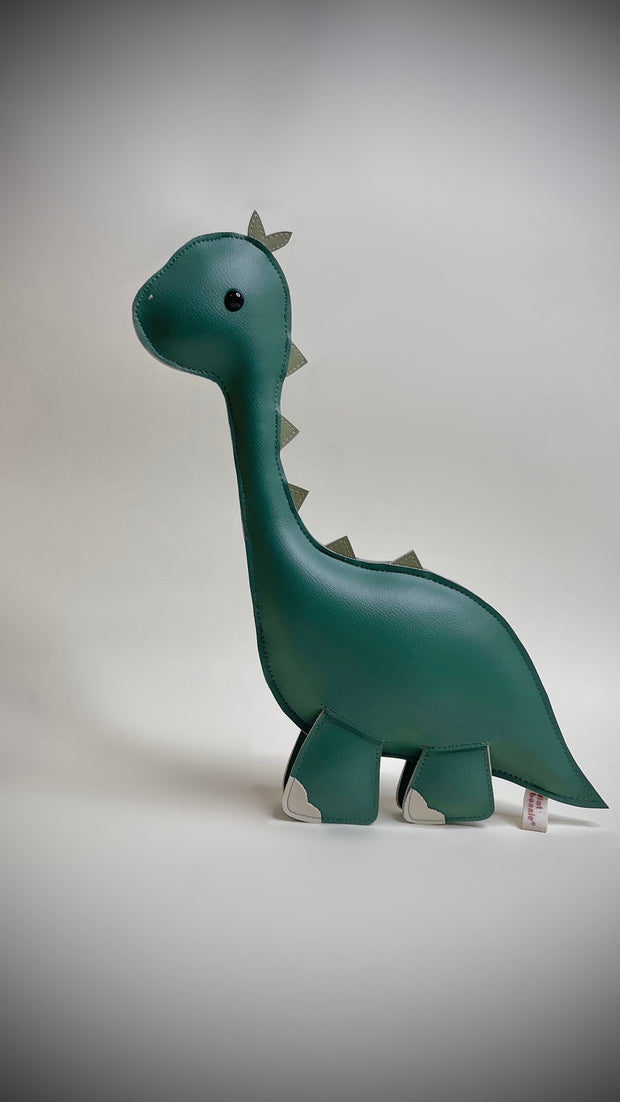 Plush, mostly flat, sculpture of a long necked green dinosaur with cute beaded eyes.