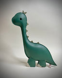 Plush, mostly flat, sculpture of a long necked green dinosaur with cute beaded eyes.
