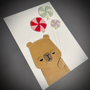 Vinyl fabric art on paper of an unimpressed capybara holding a bunch of pinwheel design round candy balloons.