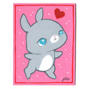 Painting of a gray cartoon bunny with a large head and cute blue eyes. It stands on 2 legs like a person and has a red heart floating over its head. Background is pink with white dots and a red line border.