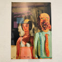 Faux movie poster for "Shizuka Idejima is a BIG OL" featuring posed vinyl figures in a scene of a sad woman and a bearded business man next to her.