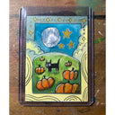 A whimsical hand-painted illustration of a black cat in a pumpkin patch under a starry night sky, set on a rustic wooden background.
