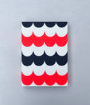 Painting of several layers of scalloping pattern in navy blue, white and red.