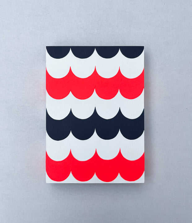 Painting of several layers of scalloping pattern in navy blue, white and red.