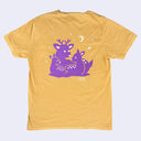 Yellow t-shirt with purple deer graphic on a light gray background