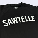 Black sweatshirt with 'SAWTELLE' applique letters in white on a light gray background