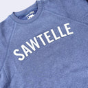 Blue sweatshirt with 'SAWTELLE' felt letters applique'd on it, featuring a brand logo.