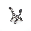 Zebra figurine on a white background