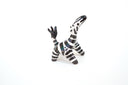 Zebra figurine on a white background