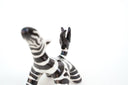 Zebra figurine on a white background