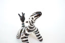 Zebra figurine on a white background