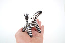 Zebra figurine on a white background