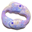 Sculpture modeled similar to an ouroboros, made of 2 fish with gold specks and star detailing.