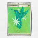 Painted over trading card with art of a hummingbird illustration with the text 'Basic Energy' on a light green card face with a silver border.