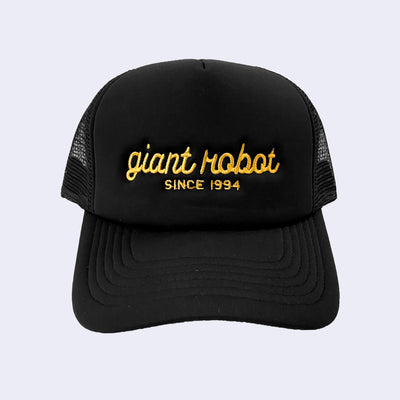 Black colored hat with "giant robot" written along the front in yellow cursive, and "since 1994" written below in plain capital font.