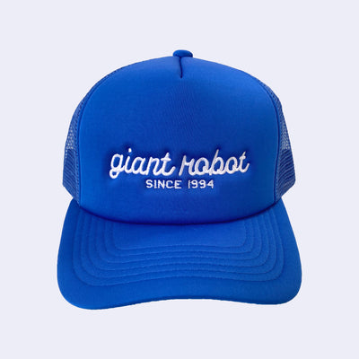 Bright blue colored hat with "giant robot" written along the front in white cursive, and "since 1994" written below in plain capital font.